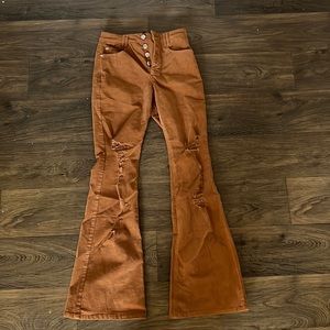 Small burnt orange pant will fit sizes 2-4